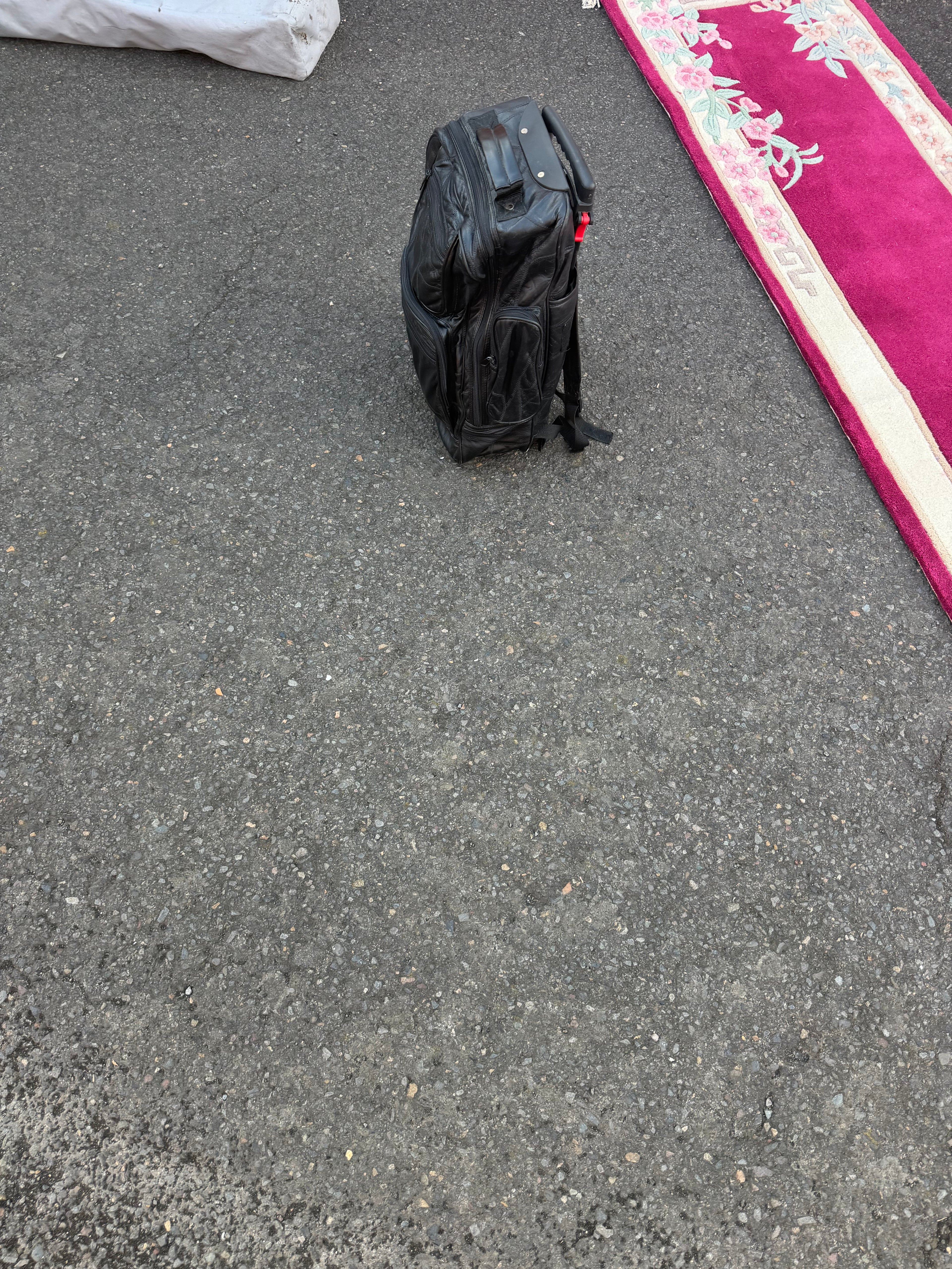Great black colored backpack with handling wheels for easy travel through the airport