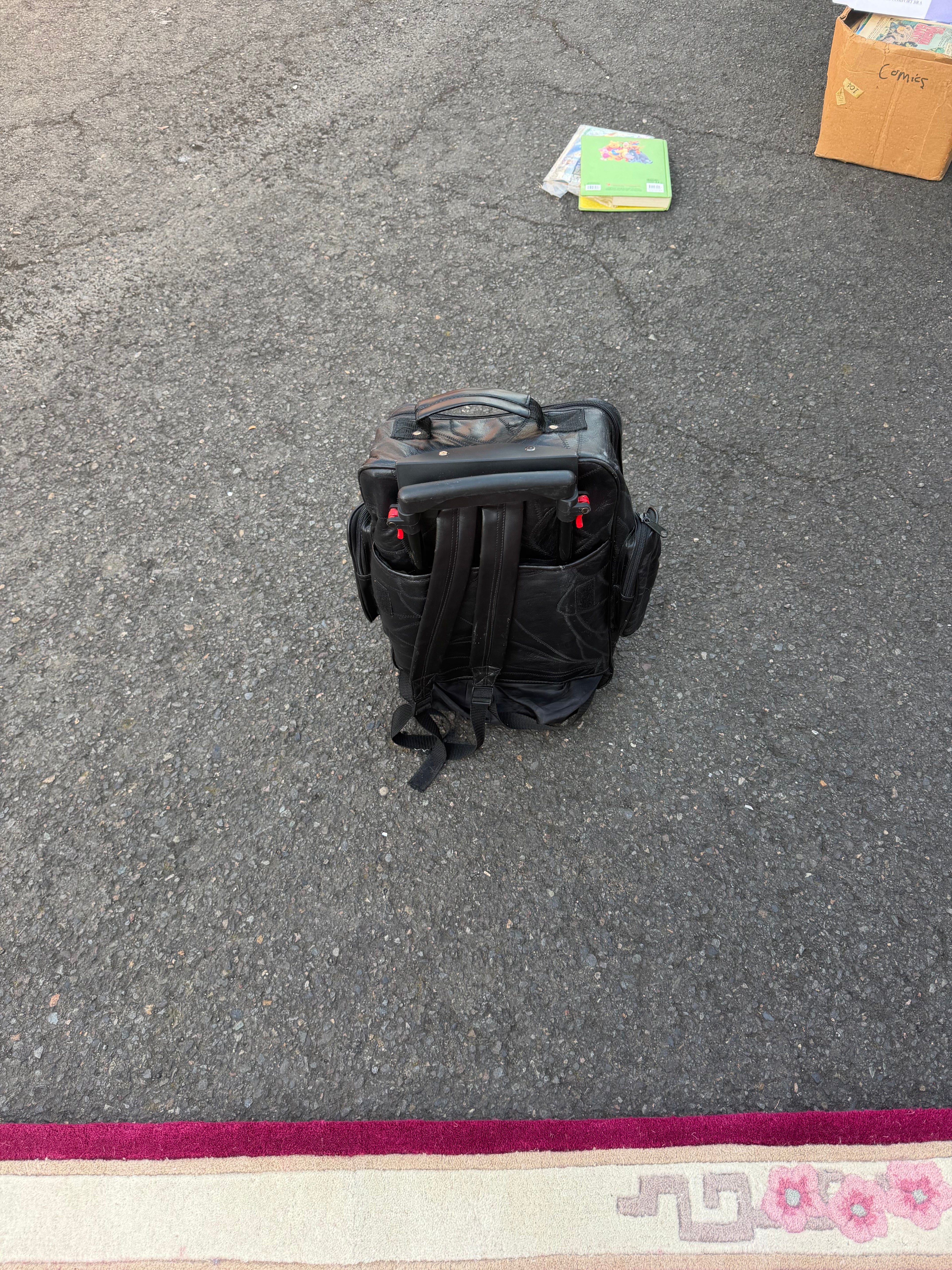 Great black colored backpack with handling wheels for easy travel through the airport